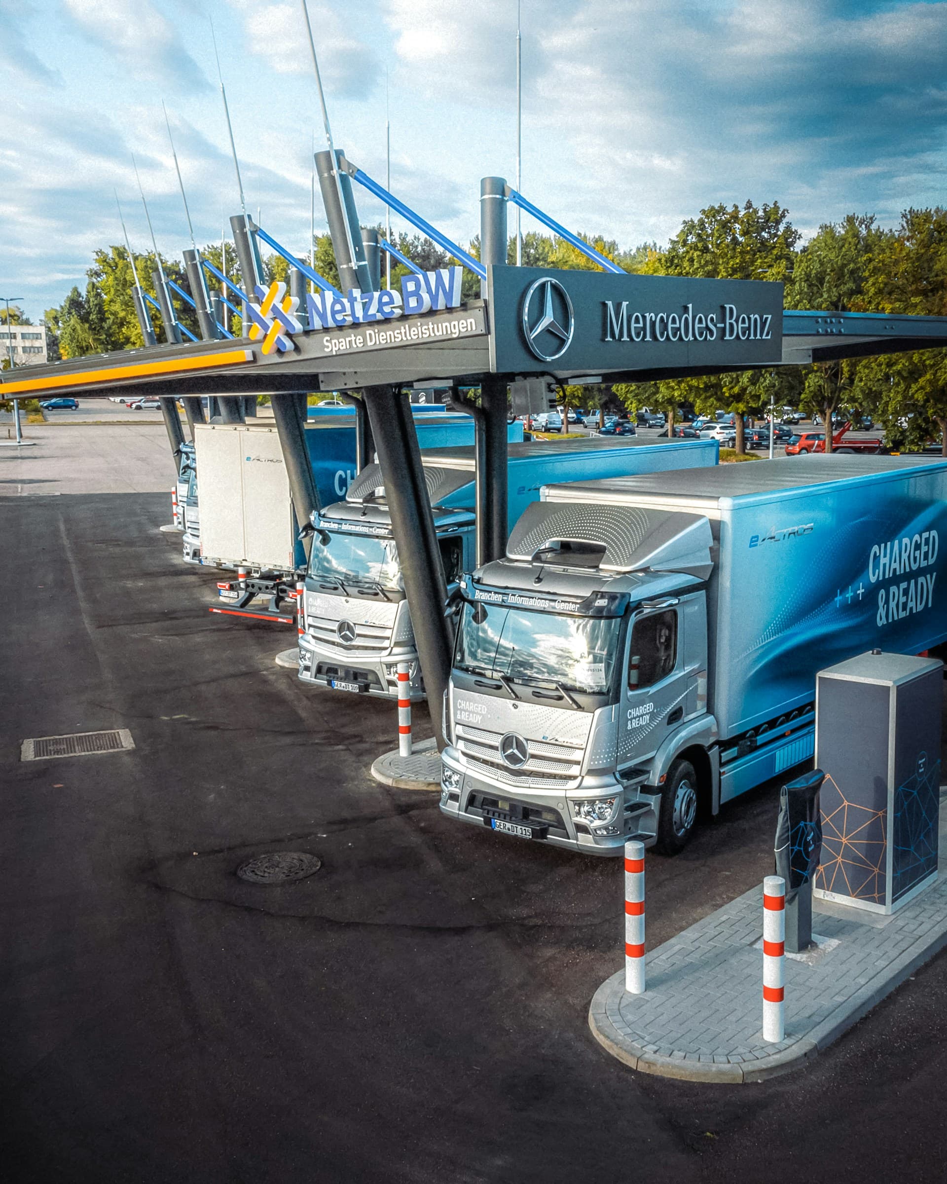 Commercial electric trucks at a charging station